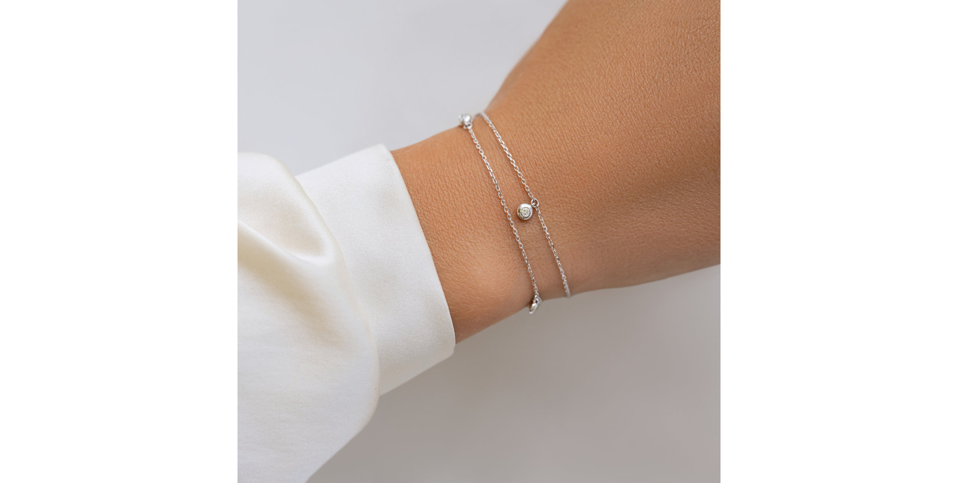 Náramek 14kt bílé zlato s diamantem Delouise